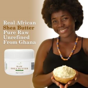 Woman holding bowl of shea butter